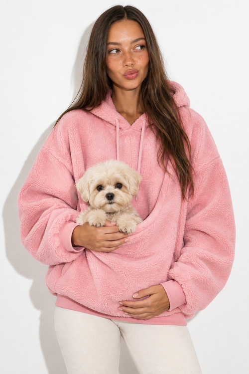 Pink Pawttle Cuddle Hoodie modeled with a small dog against a white studio background